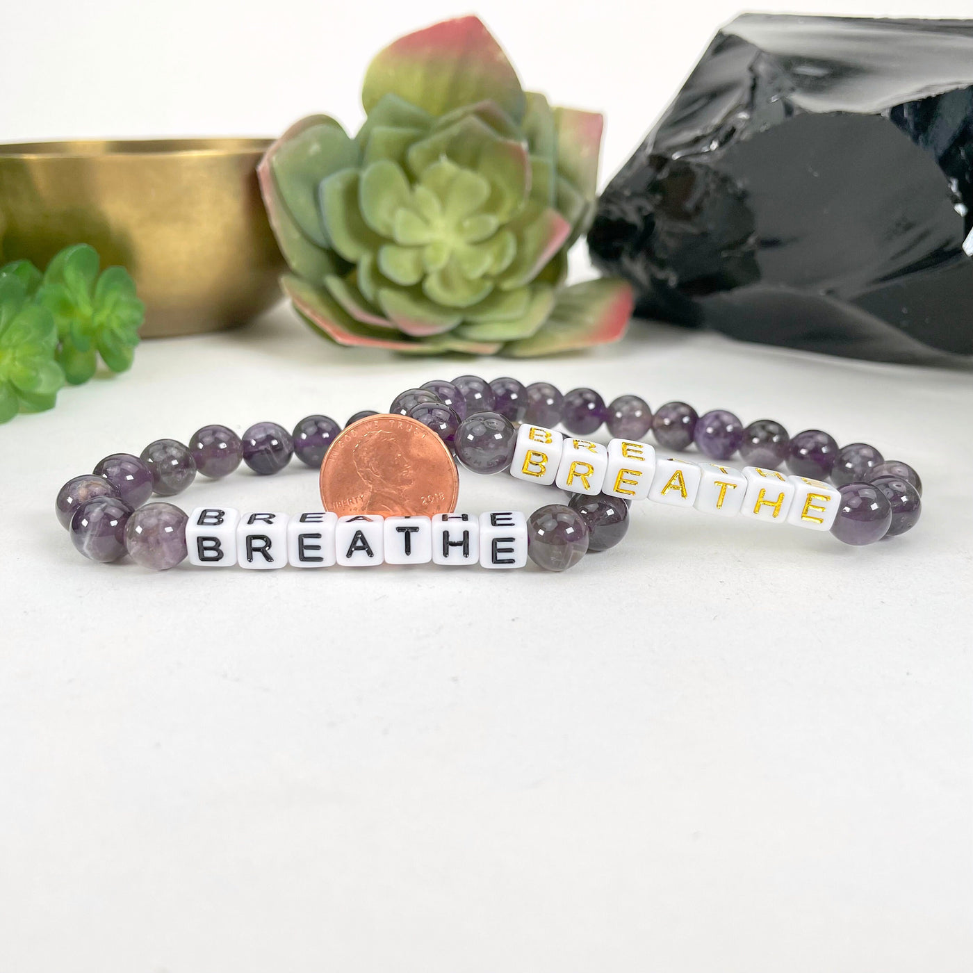 amethyst Crystal Mala Bead Bracelet - BREATHE , next to a coin for size reference