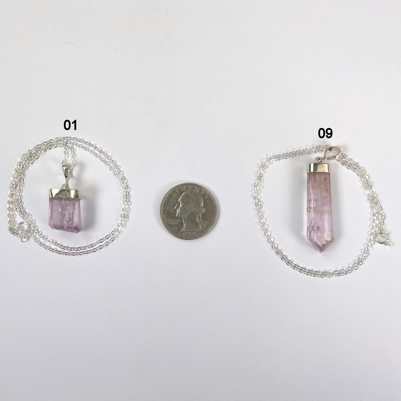 Pink Kunzite Necklace with Sterling Silver Chain next to a coin for size reference