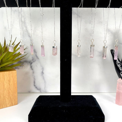 Pink Kunzite Necklaces with Sterling Silver Chains on a necklace holder
