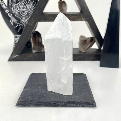 selenite with decorations in the background