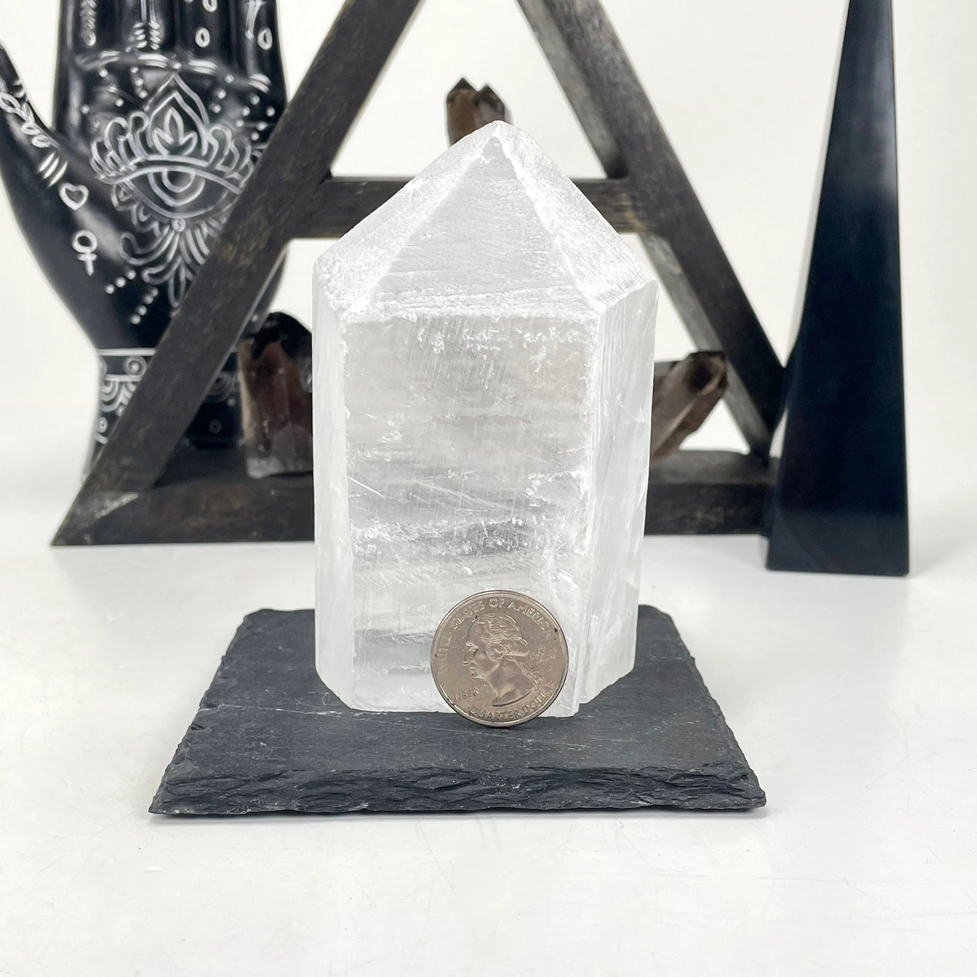 selenite with decorations in the background