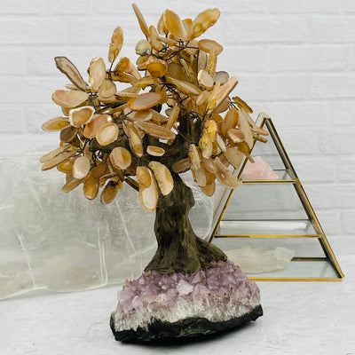 Agate tree with decorations in the background