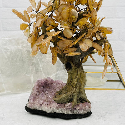 Agate tree with decorations in the background