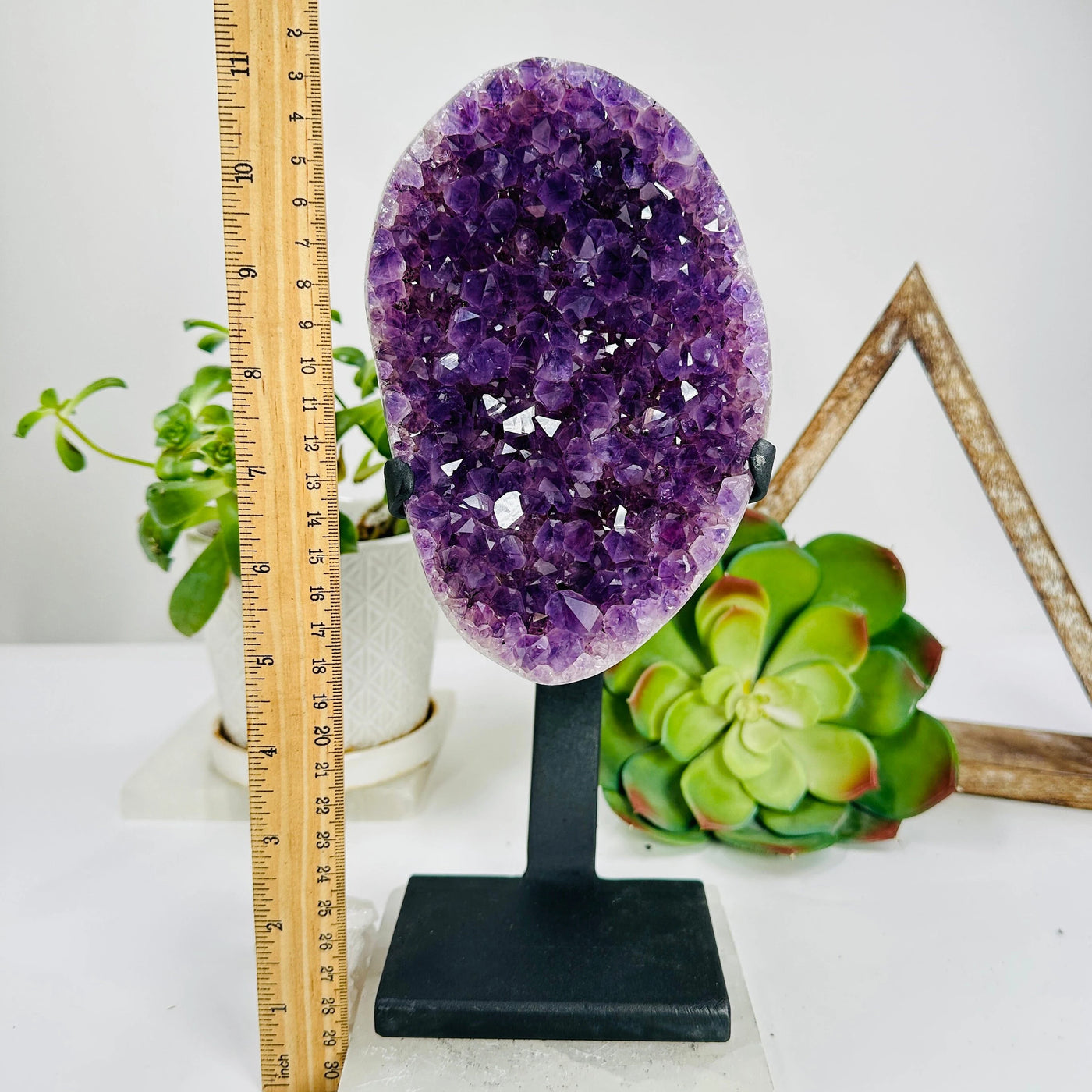 amethyst on stand on white background