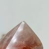 Close up view of tiny chip on top of Hematoid Semi Polished Crystal Point AS IS.