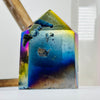Back view of Rainbow Titanium Agate Crystal Point on white base for reference.
