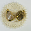 Two Smokey Quartz Semi Polished Gold Electroplated Pendants on white background for reference.