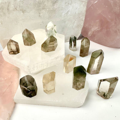 Crystal Quartz Points with Inclusions - Small Crystals - You Choose all variants on display on stone platters