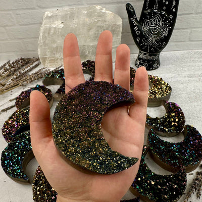 Titanium Druzy Crystal Crescent Moon - YOU CHOOSE moon in hand with other moons in background