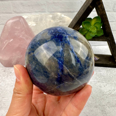 Sodalite Sphere - Crystal Ball - OOAK in hand for size reference