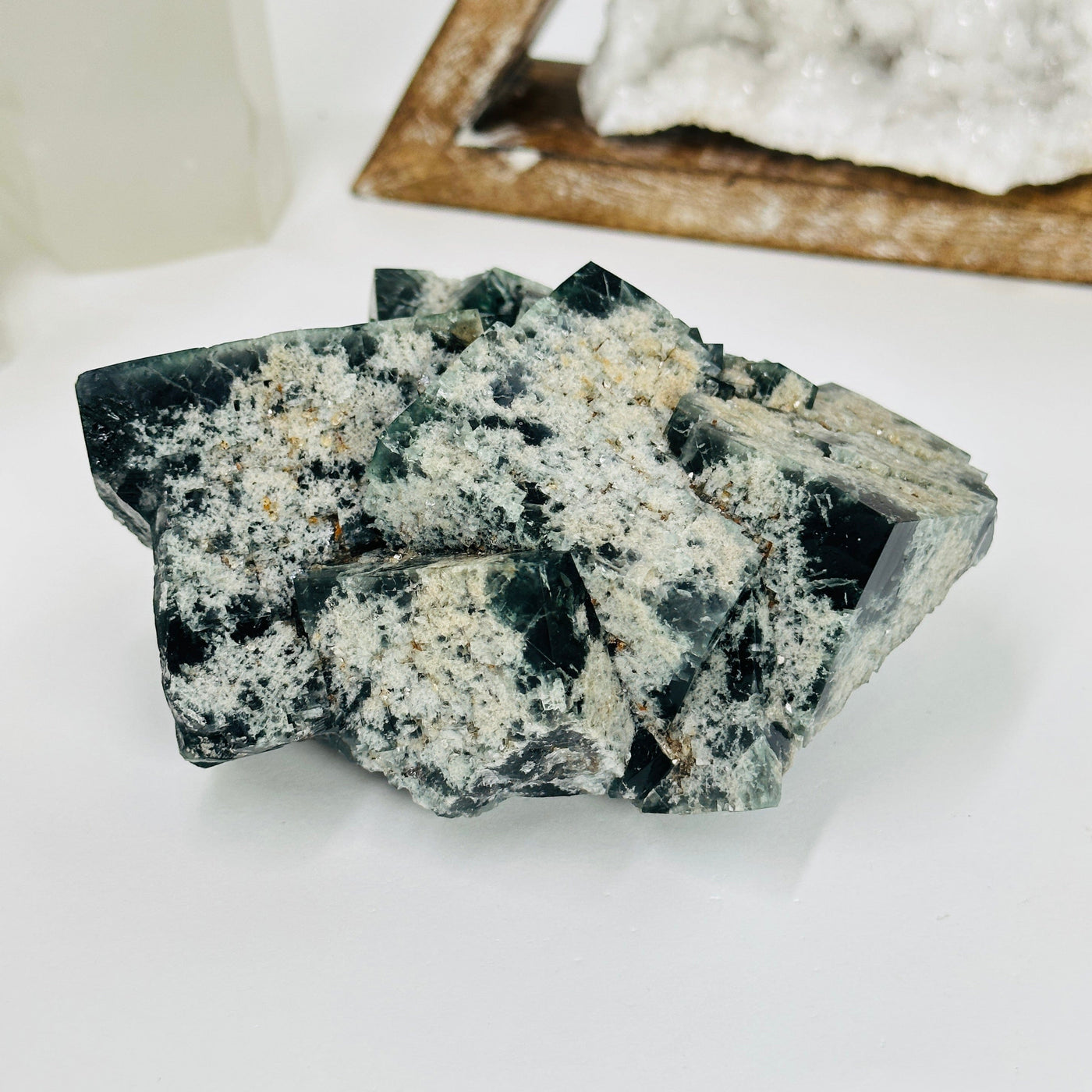 milky way fluorite with decorations in the background