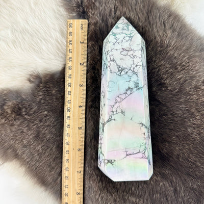 white howlite aura tower next to a ruler for size reference