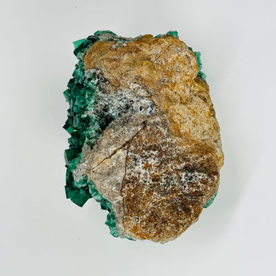 backside of fluorite formation cluster on white background