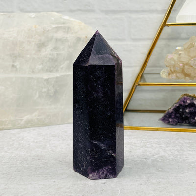 lepidolite point displayed as home decor 