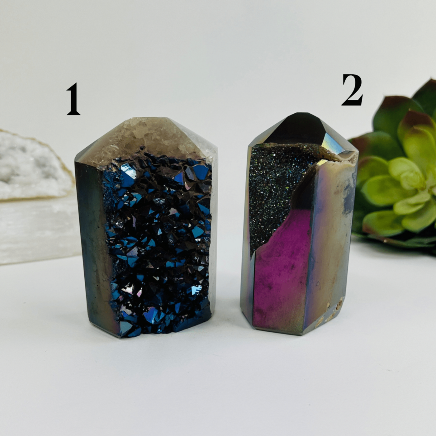 Both variants of rainbow titanium coated agate point with decorations in the background