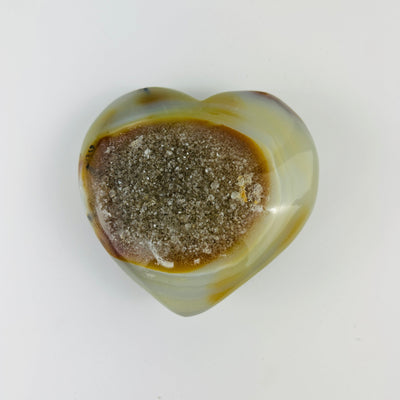 Top view of agate heart on white background