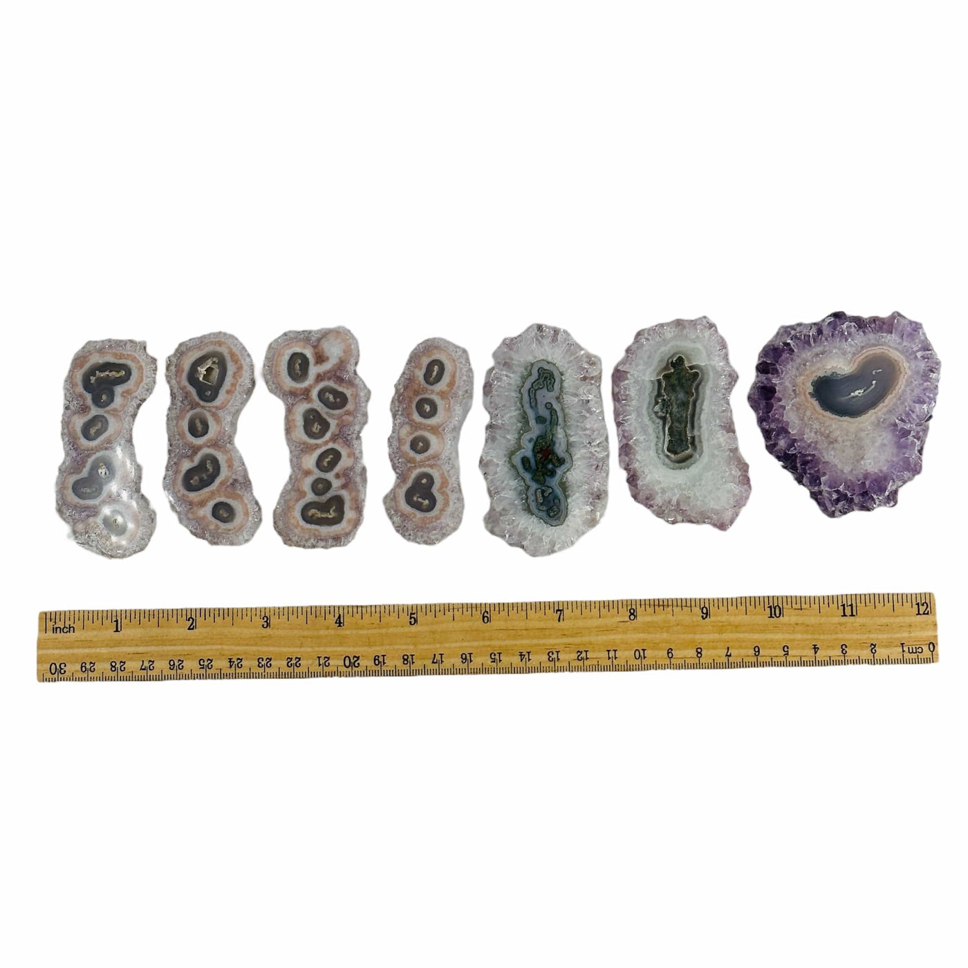 amethyst stalactites next to a ruler for size reference