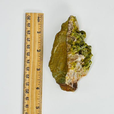 pyromorphite cluster next to a ruler for size reference