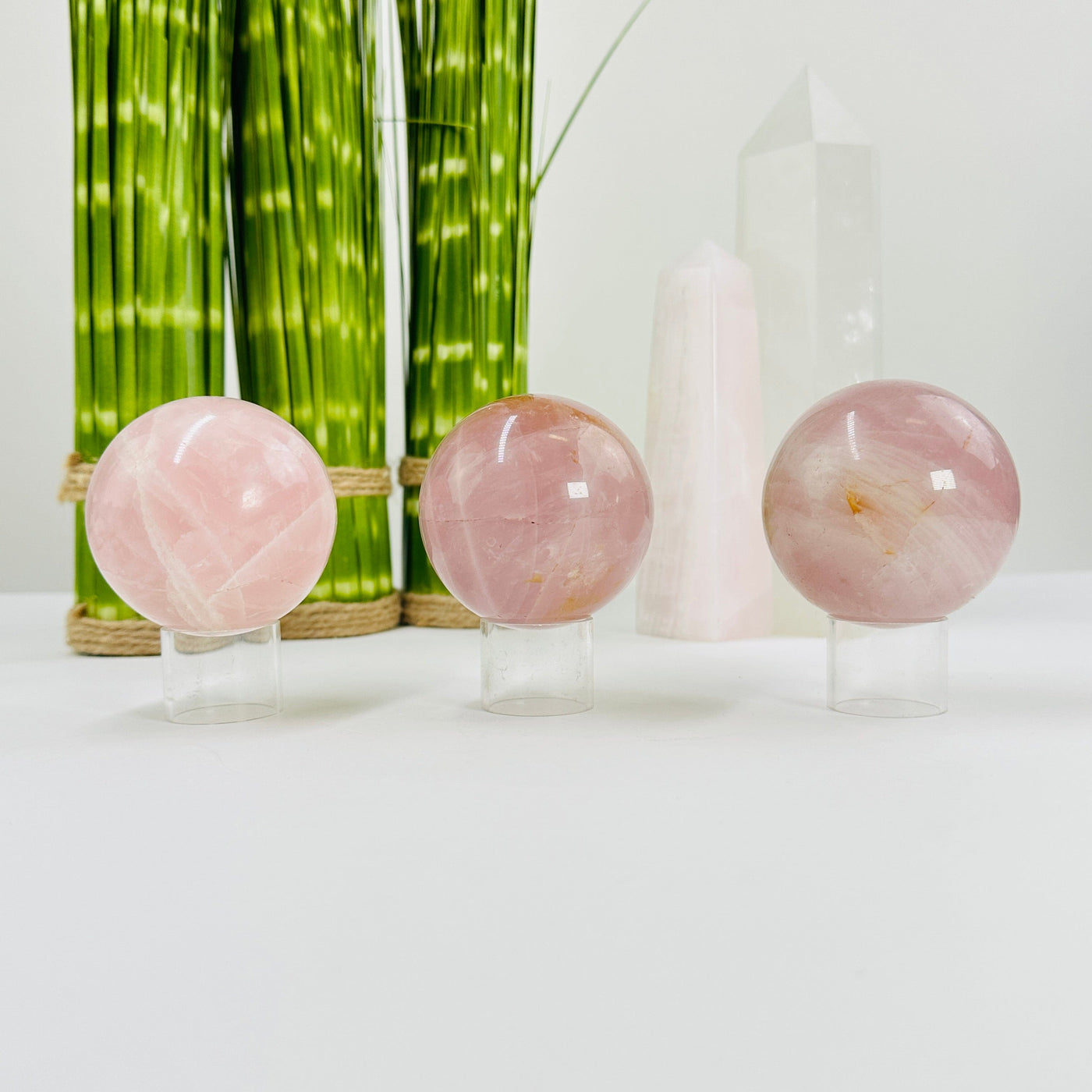rose quartz spheres with decorations in the background