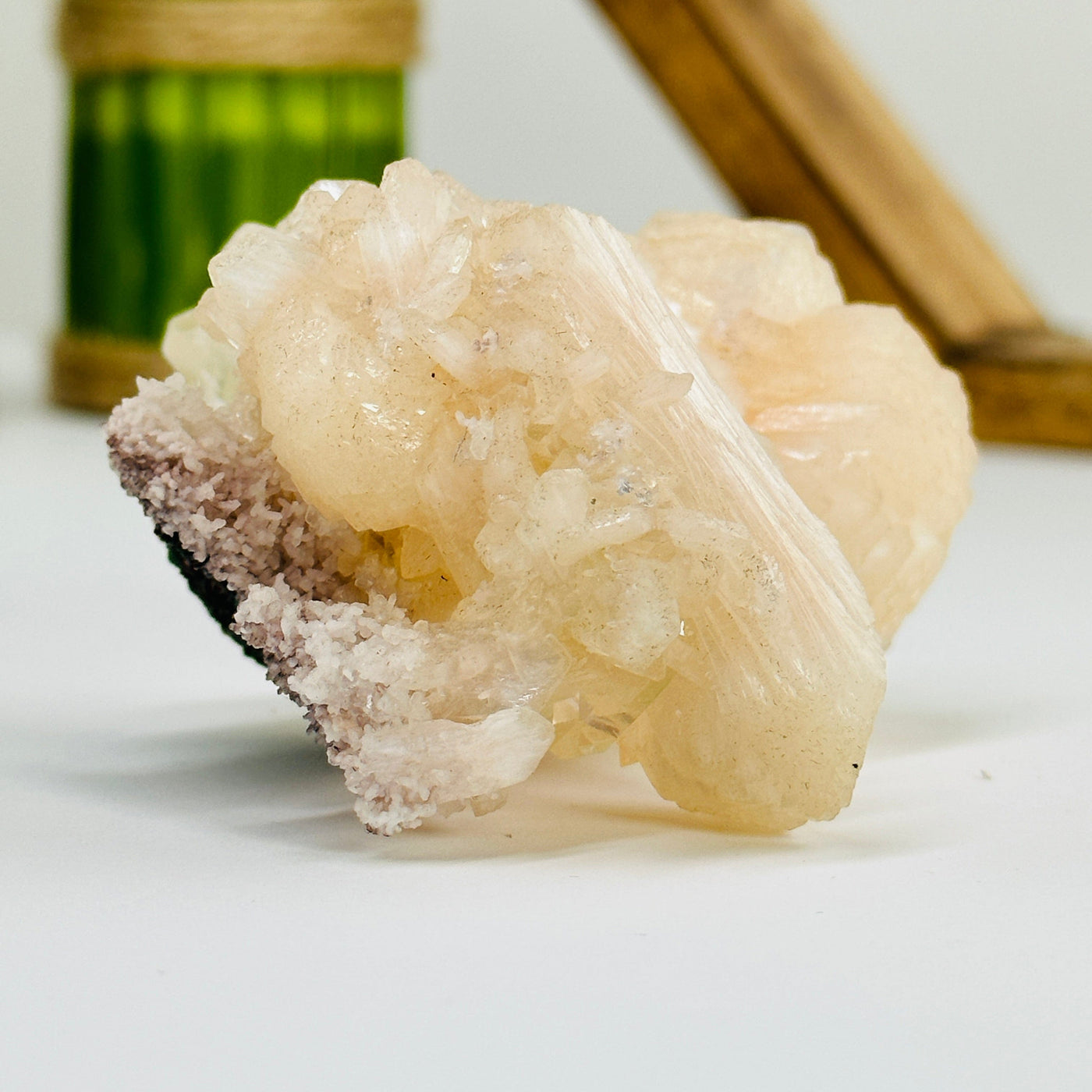 apophyllite with calcite with decorations in the background