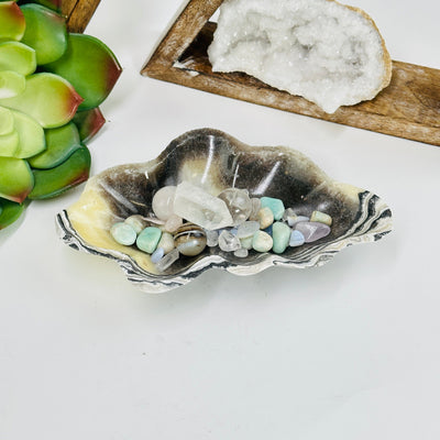 Mexican onyx bowl with decorations in the background