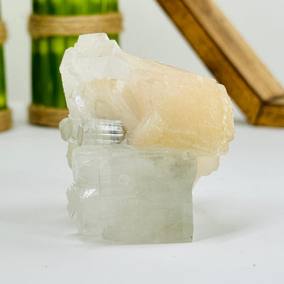 apophyllite with calcite formation with decorations in the background