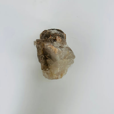 backside of Smokey quartz cluster on white background