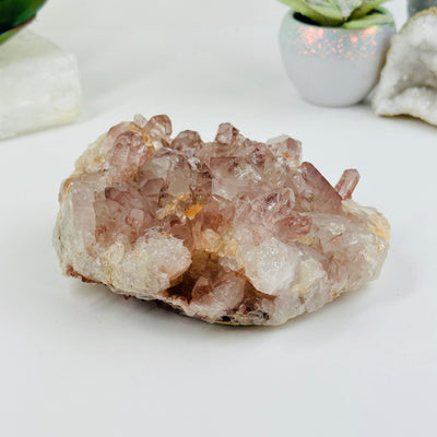 lithium quartz formation with decorations in the background