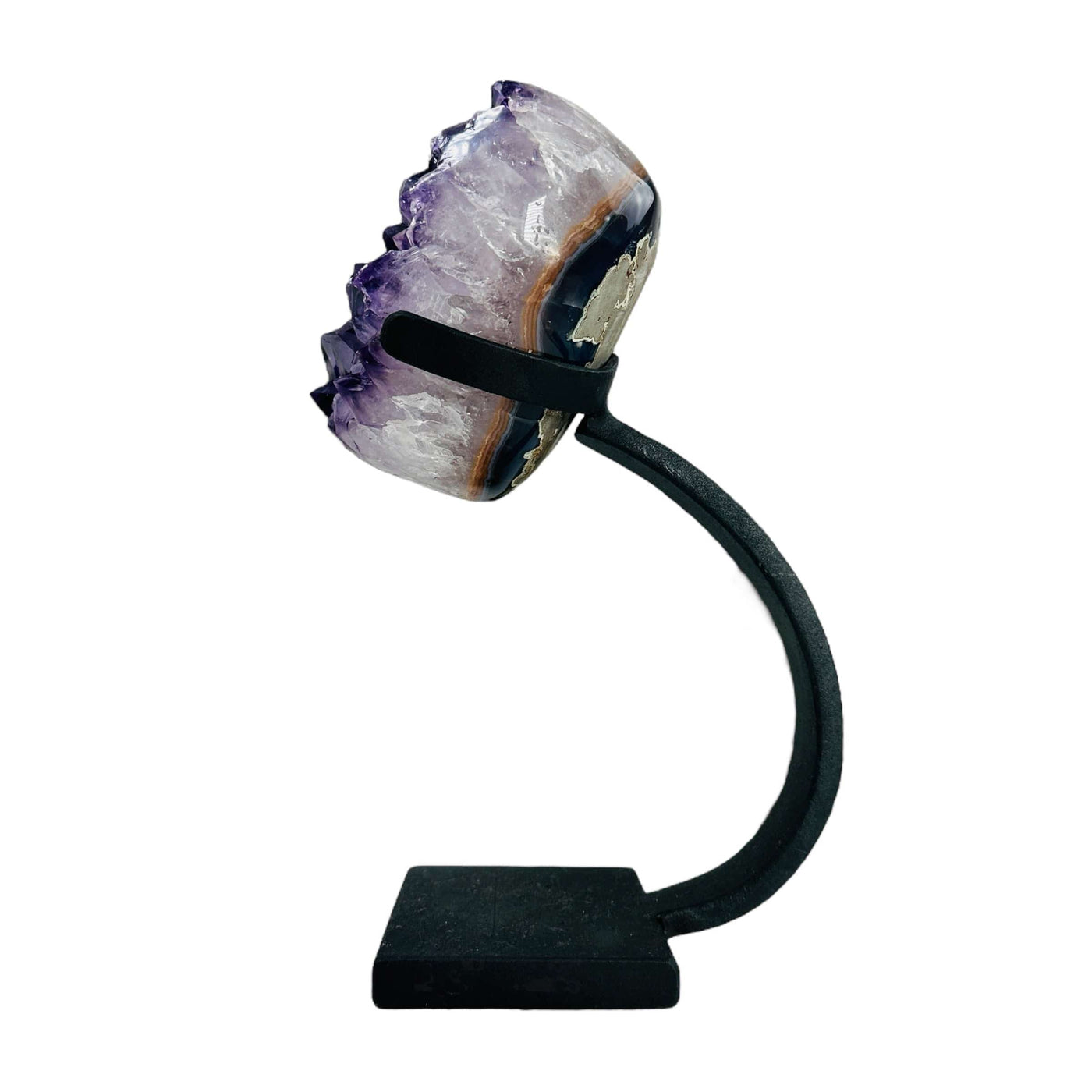 side view of polished amethyst on stand on white background