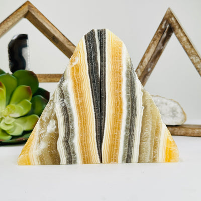 Mexican onyx bookends with decorations in the background