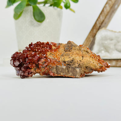 Natural vanadinite formation with decorations in the background