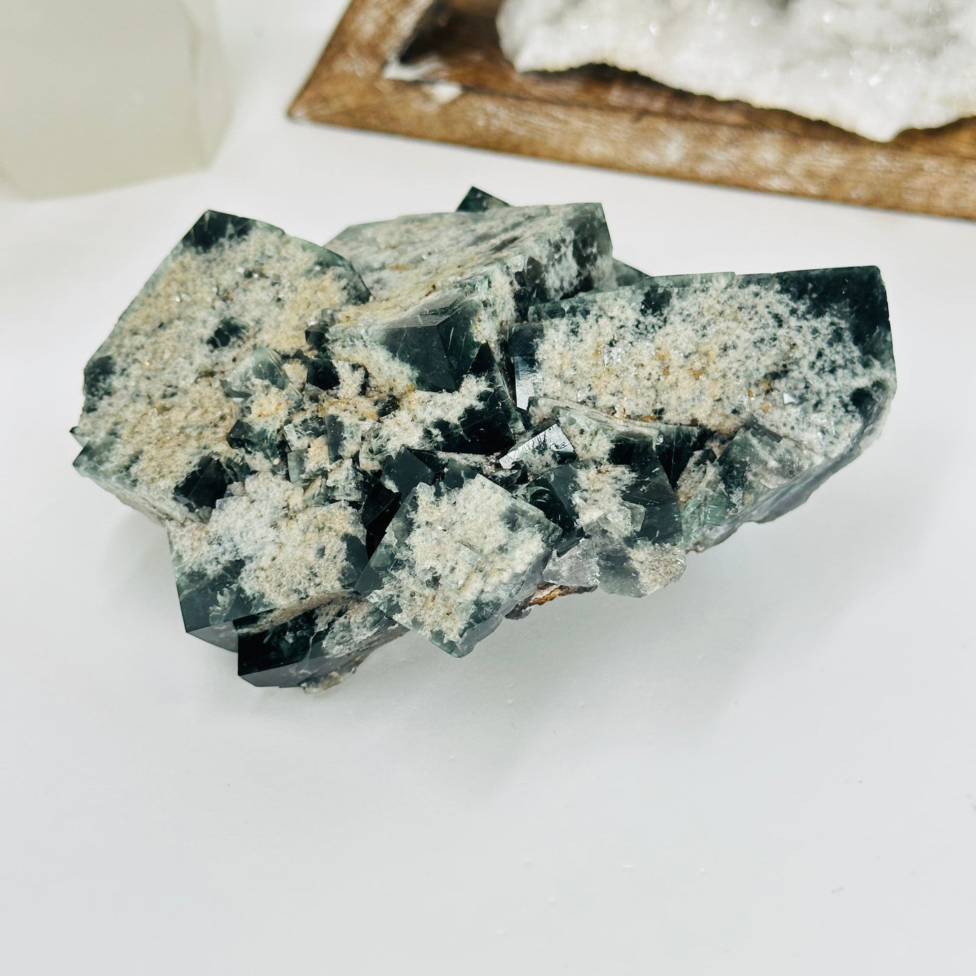 milky way fluorite with decorations in the background