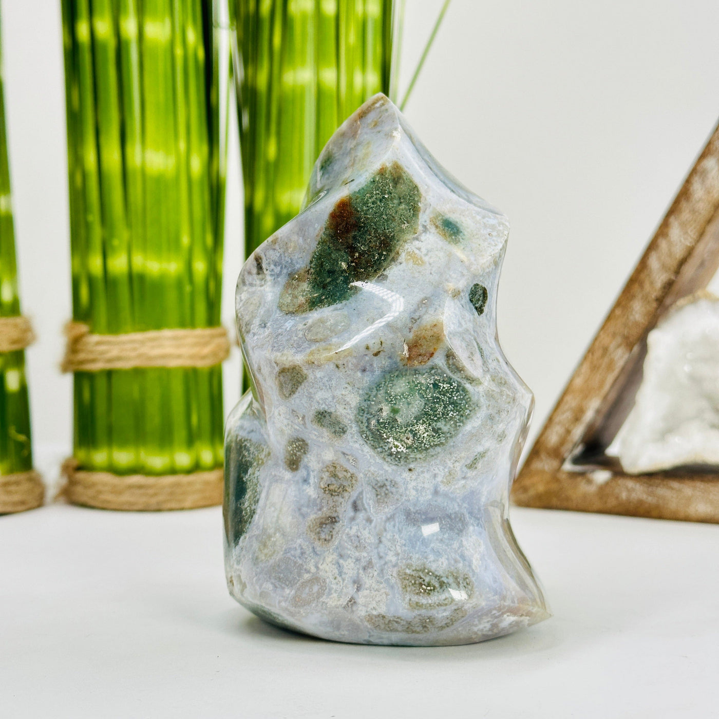 moss agate flame tower with decorations in the background