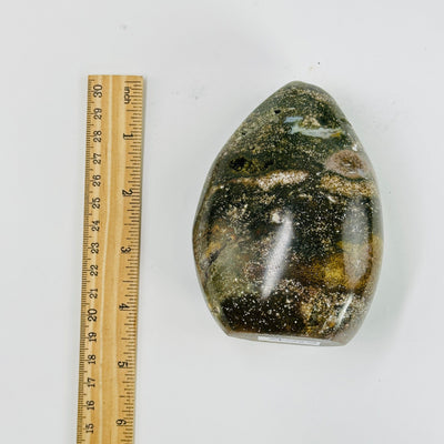 Ocean Jasper Flame Tower next to a ruler for size reference