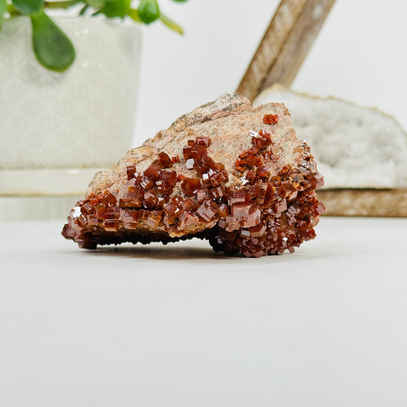 Natural vanadinite formation with decorations in the background