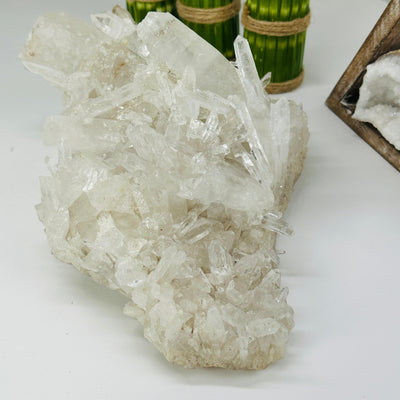 crystal quartz freeform with decorations in the background