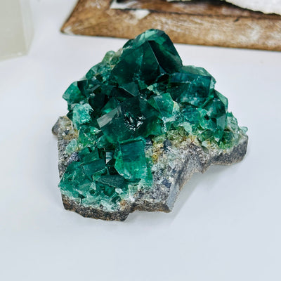 diana maria fluorite with decorations in the background