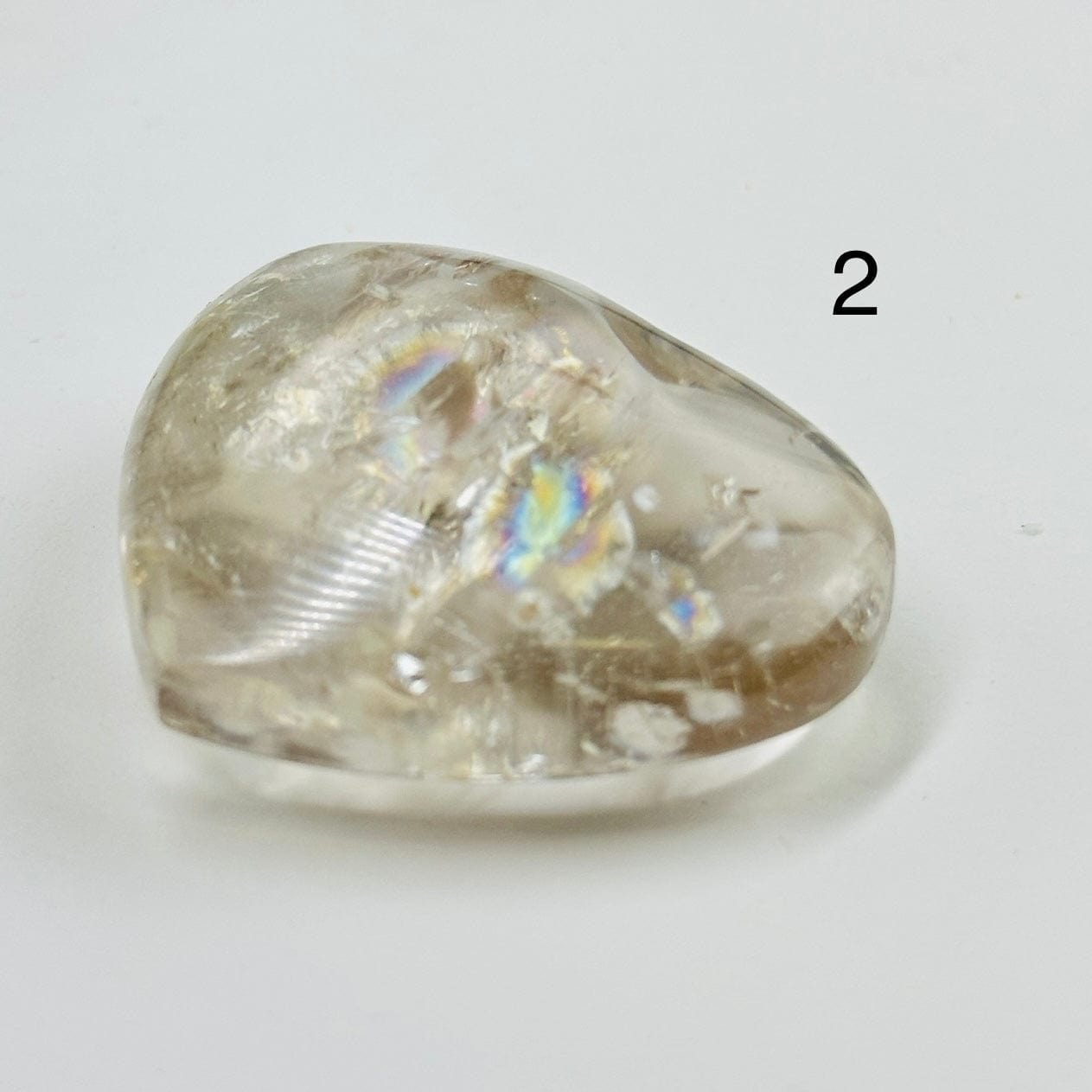 up close shot of variant 2 of crystal quartz heart showing rainbows