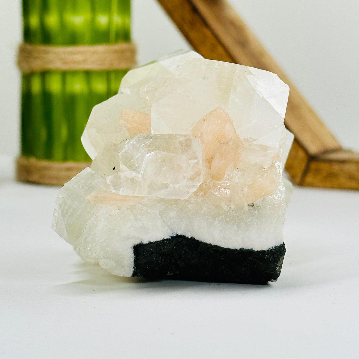 apophyllite with calcite cluster with decorations in the background