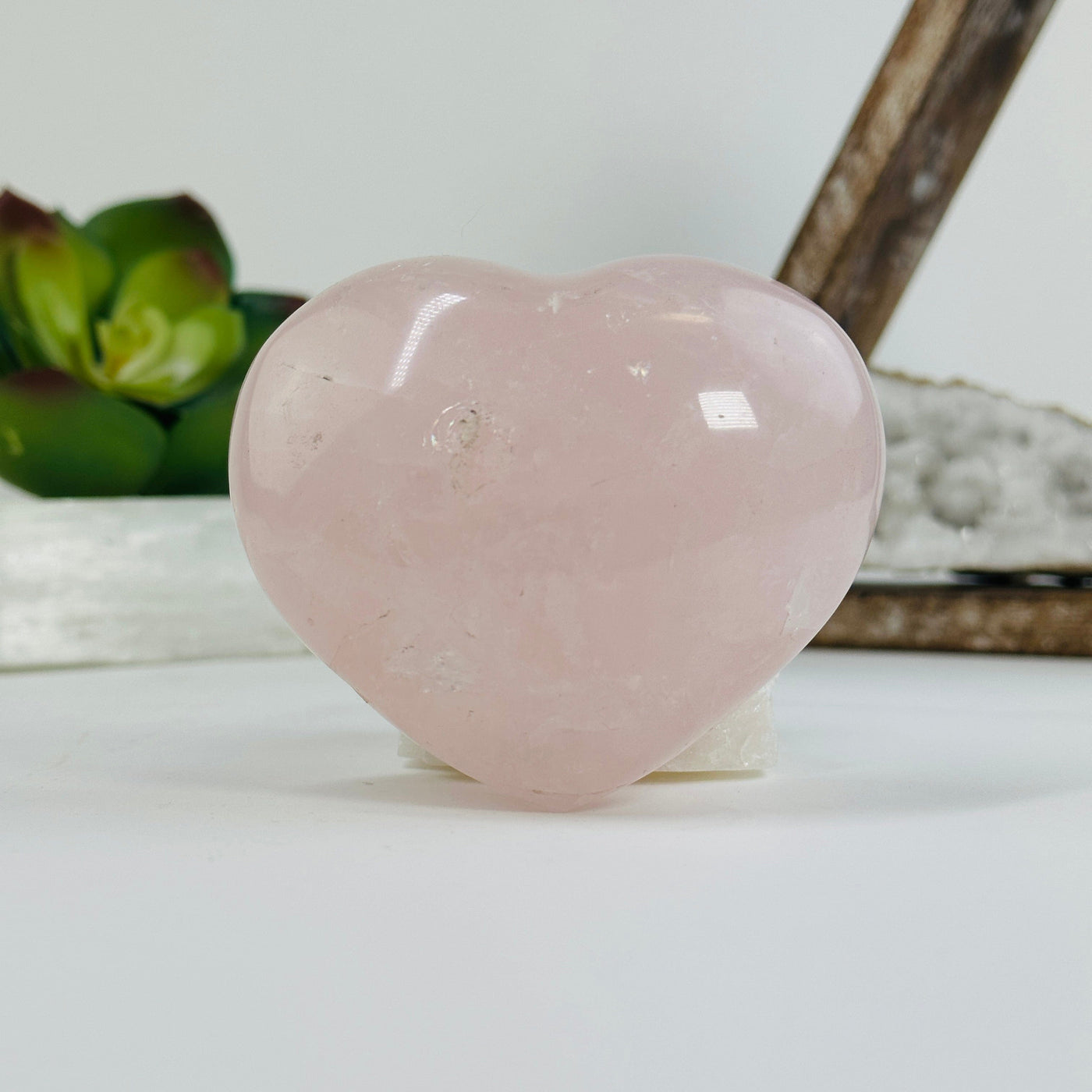 Rose Quartz Puffy heart with decorations in the background