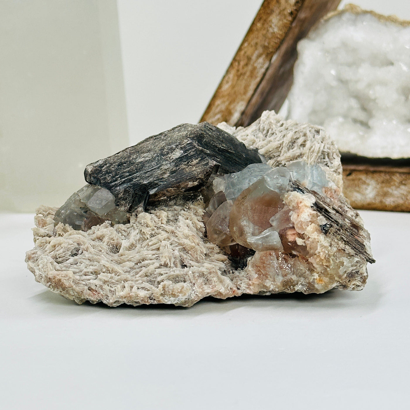 topaz with polylithionite with decorations in the background