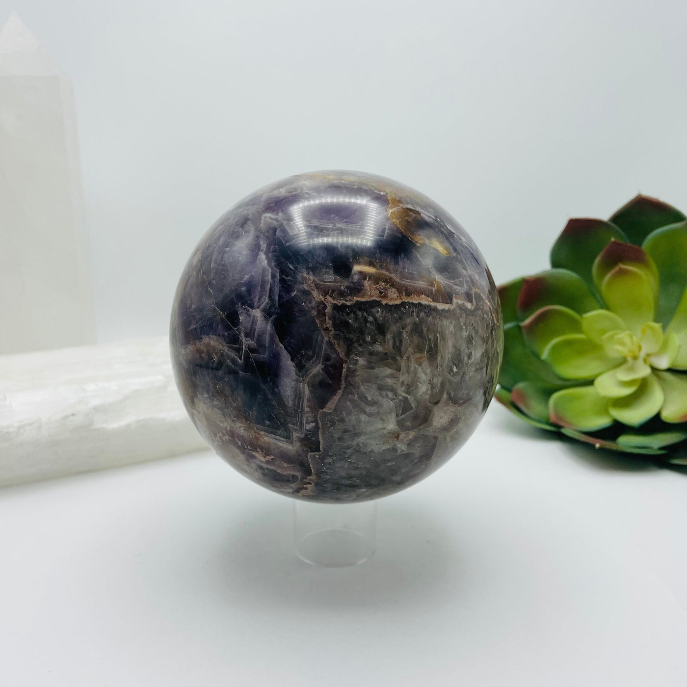 Chevron amethyst sphere with decorations in the background