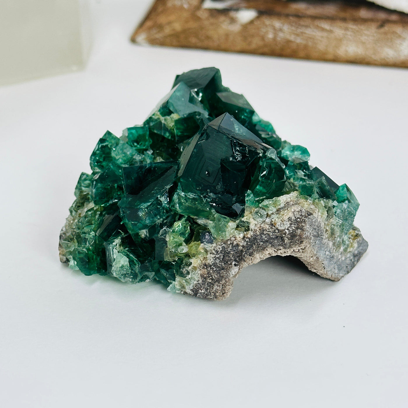 diana maria fluorite with decorations in the background