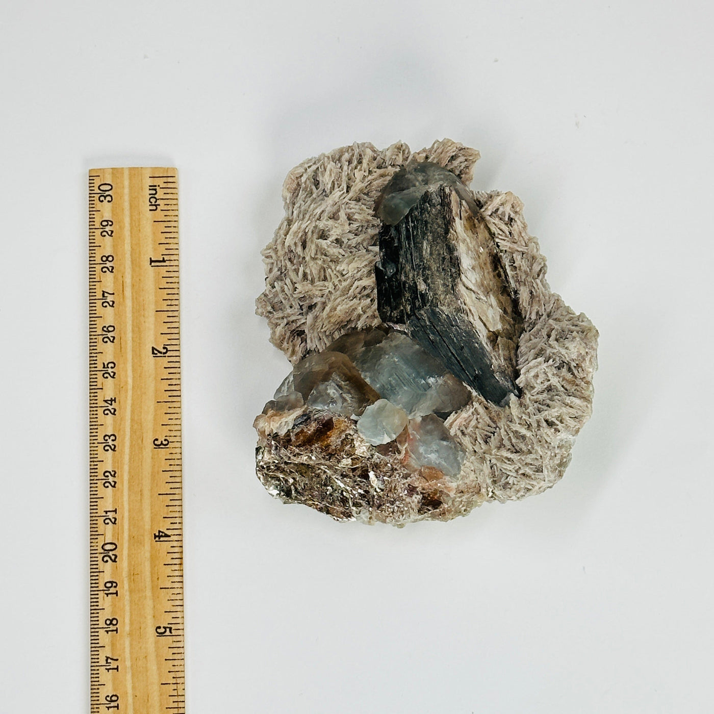 topaz with polylithionite next to  ruler for size reference