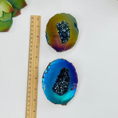 rainbow titanium coated geode box next to a ruler for size reference