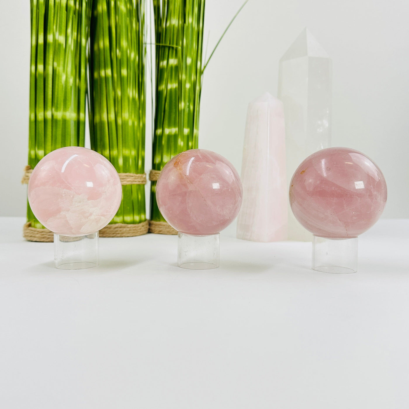 rose quartz spheres with decorations in the background