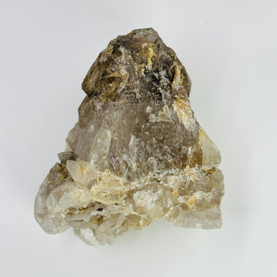 bottom side of smokey quartz cluster on white background