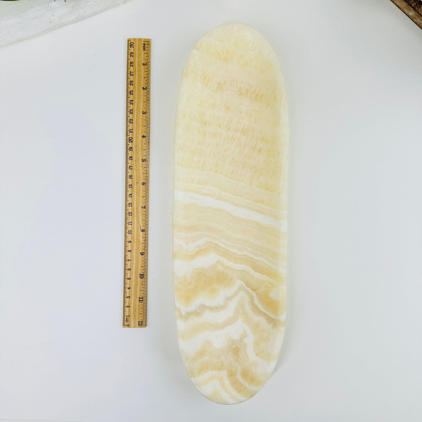 mexican onyx long bowl next to a ruler for size reference
