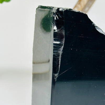 up close shot of large chip on obsidian bookend