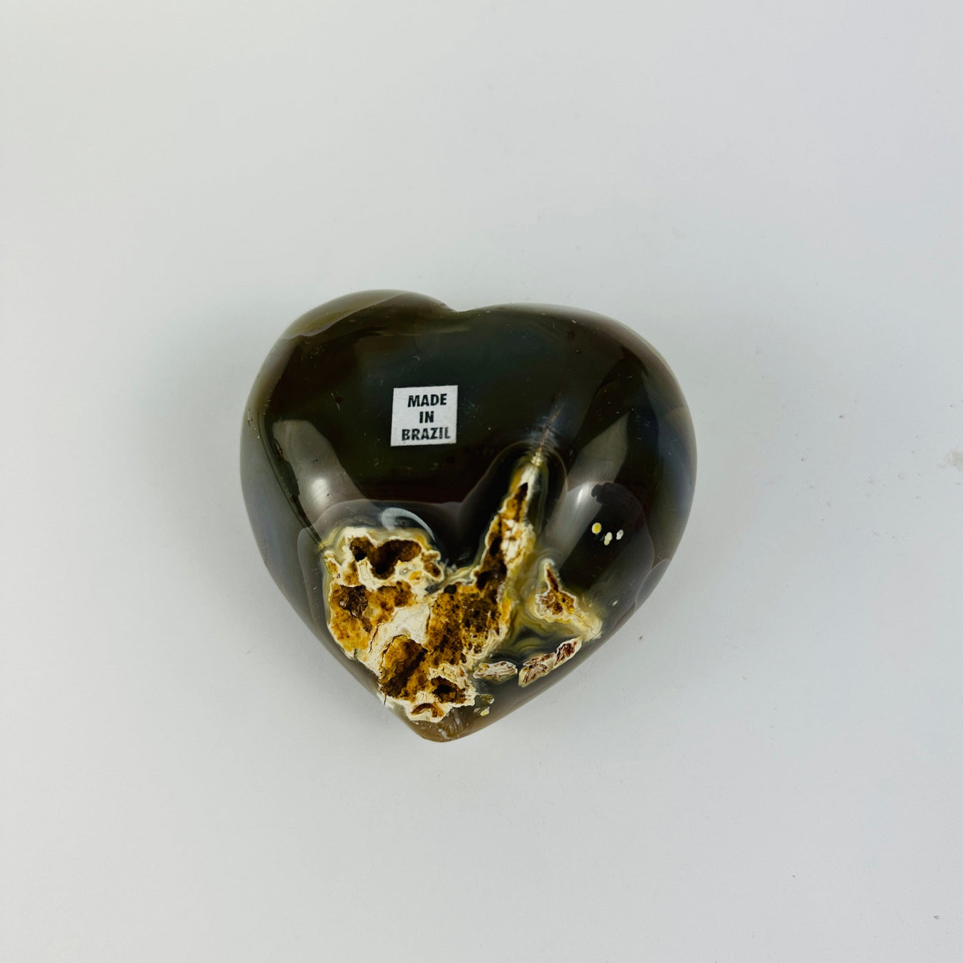 back side of agate heart on white background